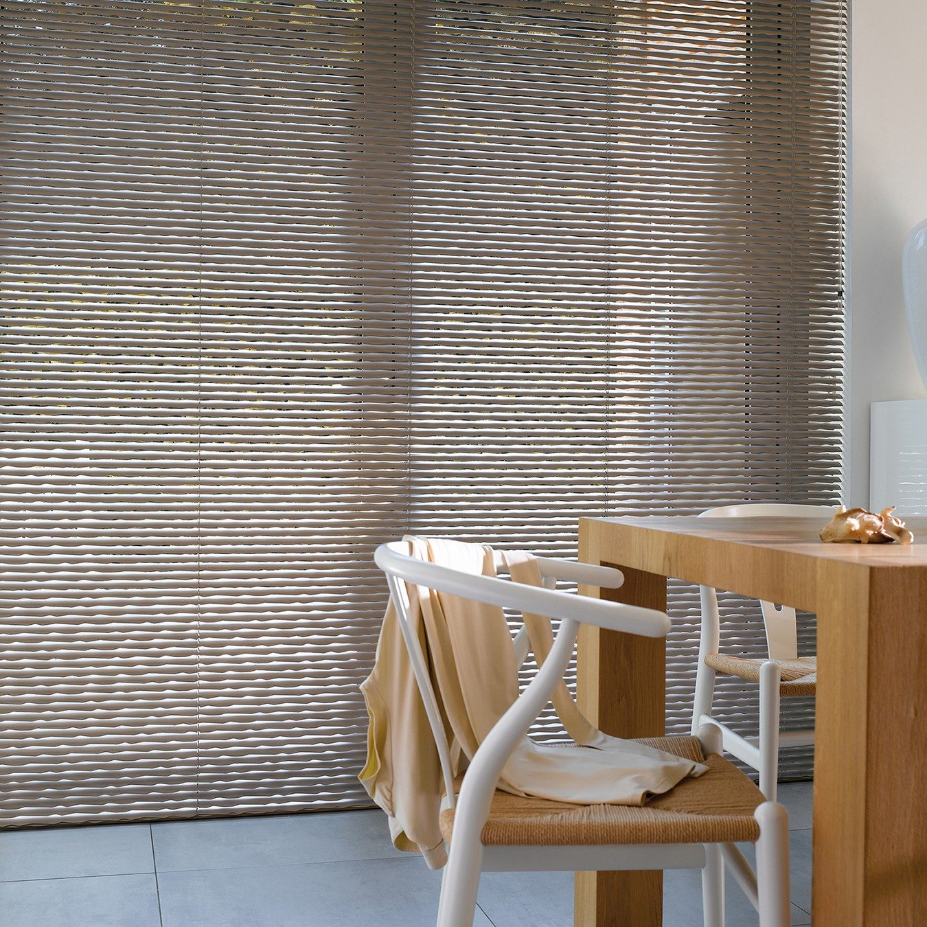 aluminium venetian blinds in a dining room over doors