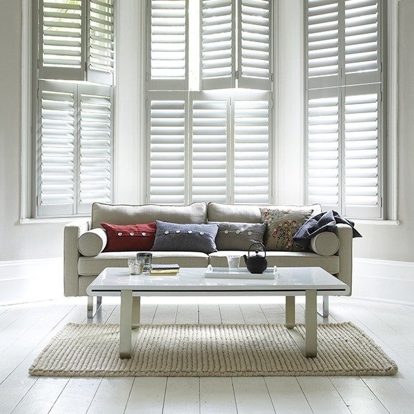 bifold interior shutters in a tall bay window